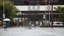 Наводнена улица в град Сага, Япония. Евакуирани са близо 850 000 души в три префектури в Западна Япония заради наводнения и свлачища.
