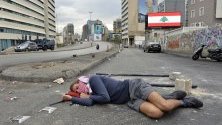 Протестиращ спи на земята край блокада на улица в Бейрут, Ливан. Демонстрациите и блокирането на пътища ще продължат до оставка на правителството и парламента.